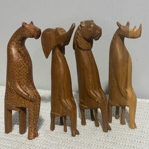 Handcrafted Wooden Animal Figurines Set lion is  wobbly.